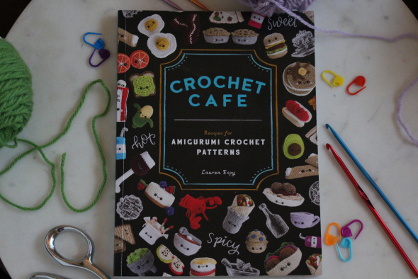 Crochet Cafe book surrounded by crocheting supplies
