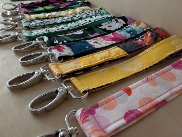 Colorful key fobs lined up on a shelf