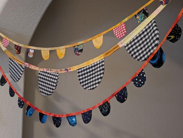 Three buntings hanging from an arch