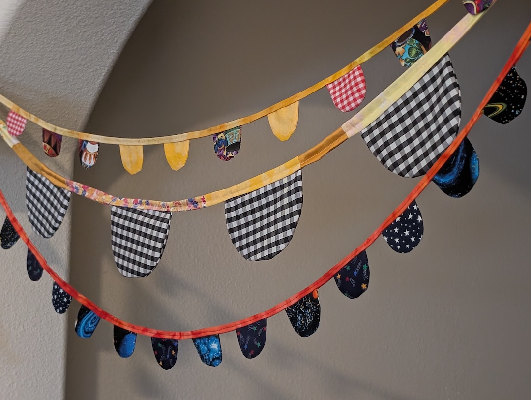 Three buntings hanging from an arch