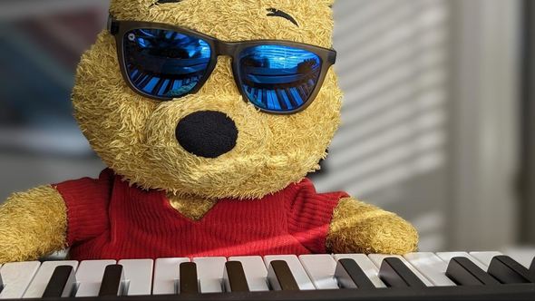 Pooh practicing piano