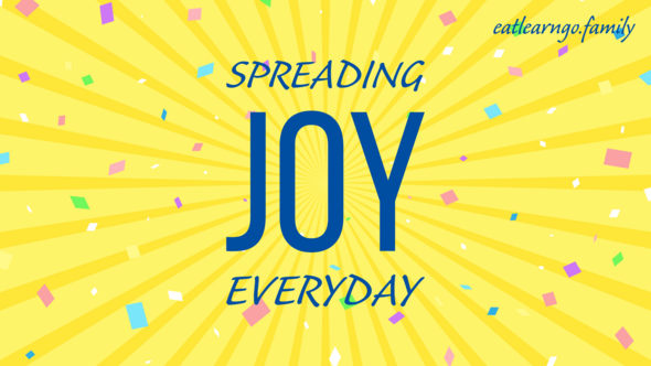 An image of yellow sunbeams with confetti that says 